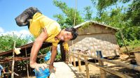 Roldan outside his new home. The Philippines. 