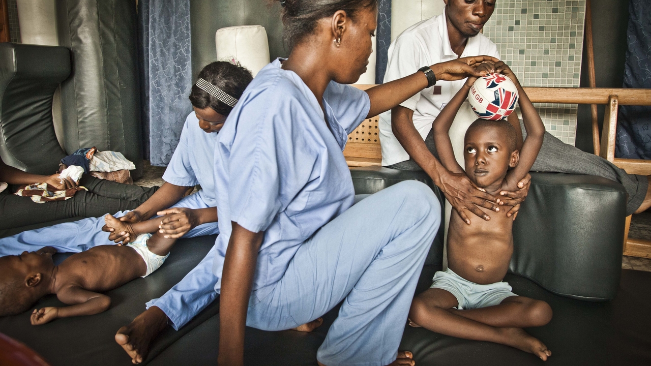 Archive image: physical therapy session, Kinshasha, 2013          