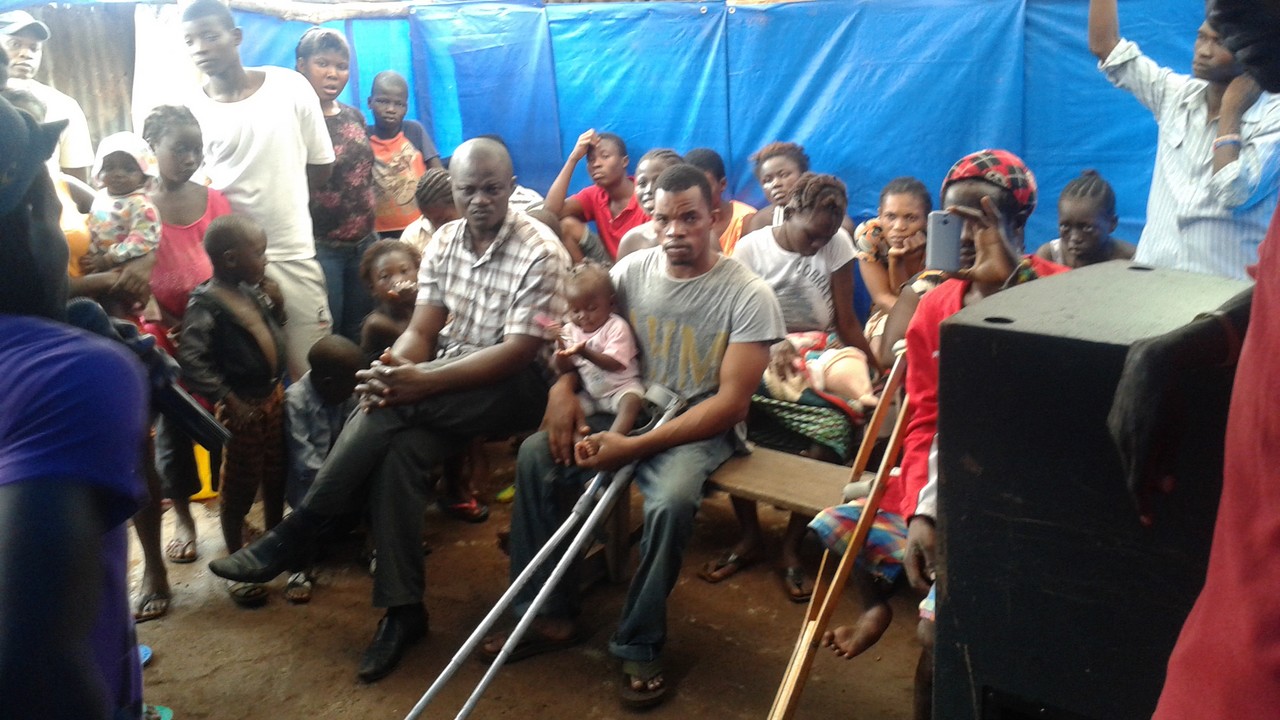 A Handicap International, ebola risk awareness session, delivered to give local redidents they need to minimize the risk of infection. Sierra Leone.