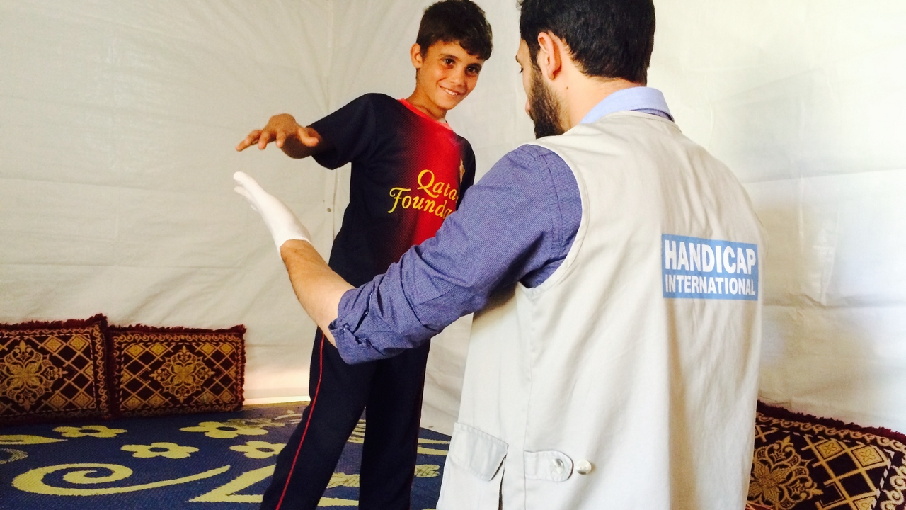 Mostafa, 8, in a physical therapy session. Lebanon.