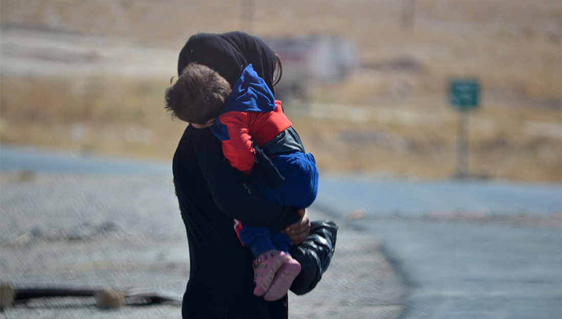 Mother and child in internally displaced persons' camp in Syria.