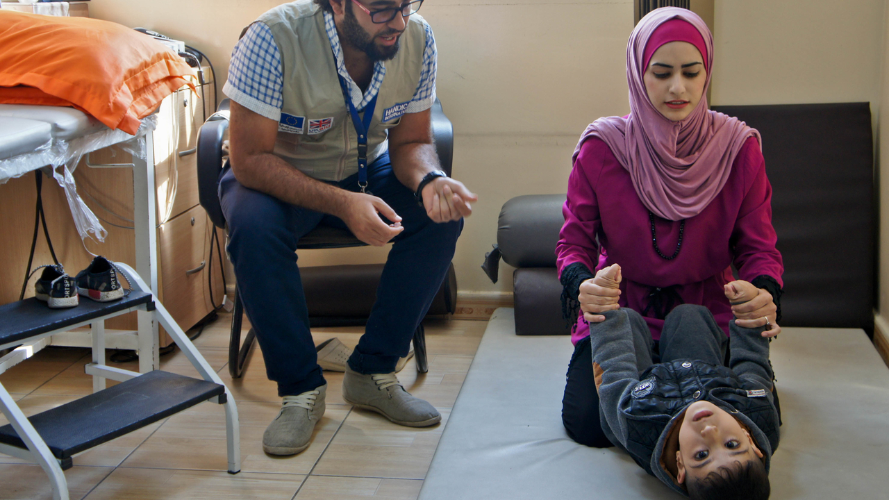  Manal, Hamzeh and Ali, during a physical therapy session.