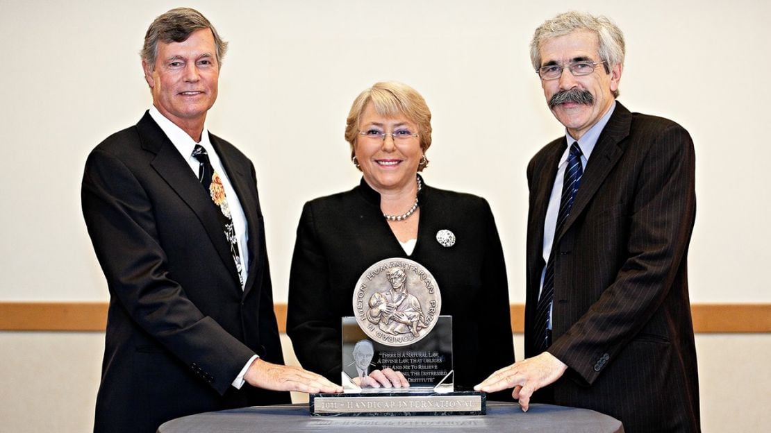 HI founder Jean-Baptiste Richardier (right) receiving the 2011 Hilton Humanitiarian Prize.