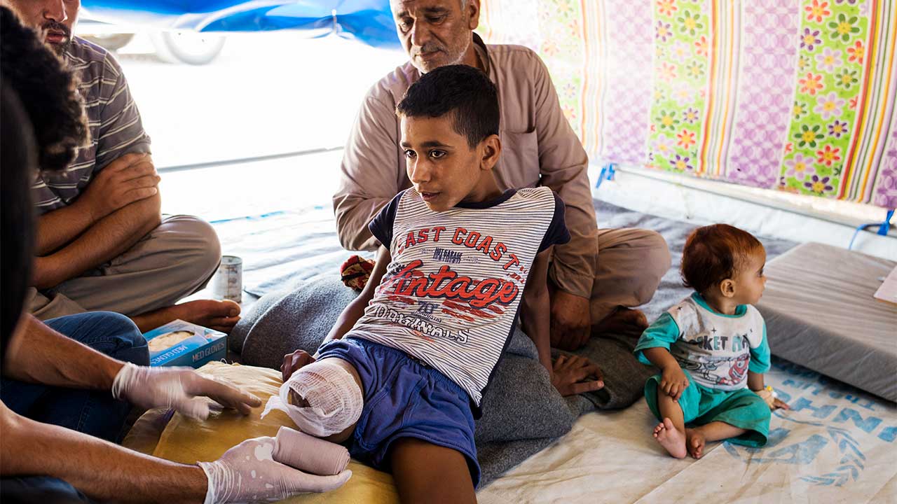 Abdel Rahman, 12, had his leg amputated after a shell exploded on his house. He is receiving care from an HI physical therapist.